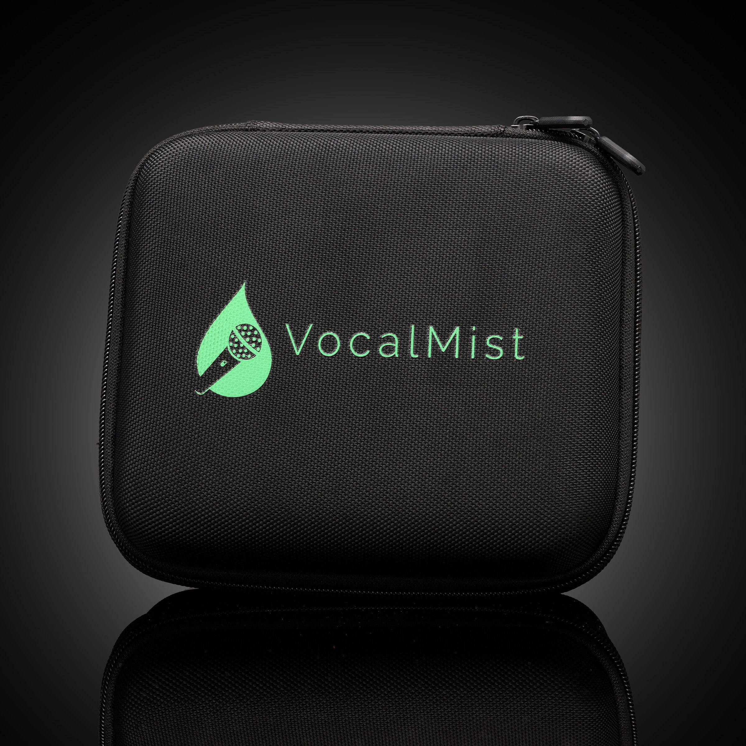 VocalMist Carrying Case — closed case packshot on dark reflective glass.
