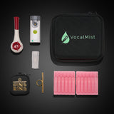 Perform & Power Pro Kit — flat-lay of kit contents on dark ground: Breather Voice, VocalMist nebulizer, carrying case, OOVO Sing Ring with case, and Hydration Formula vials.