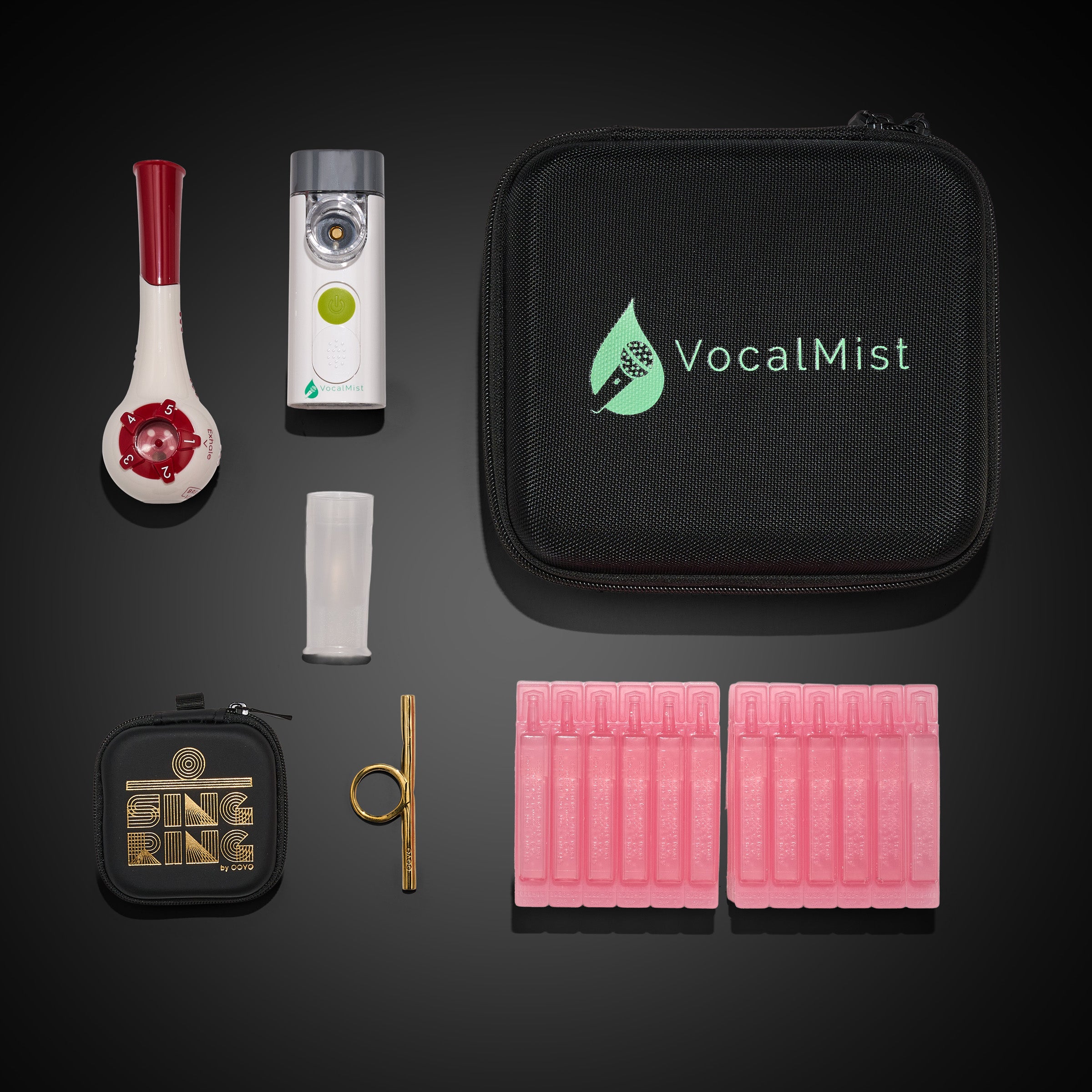 Perform & Power Pro Kit — flat-lay of kit contents on dark ground: Breather Voice, VocalMist nebulizer, carrying case, OOVO Sing Ring with case, and Hydration Formula vials.