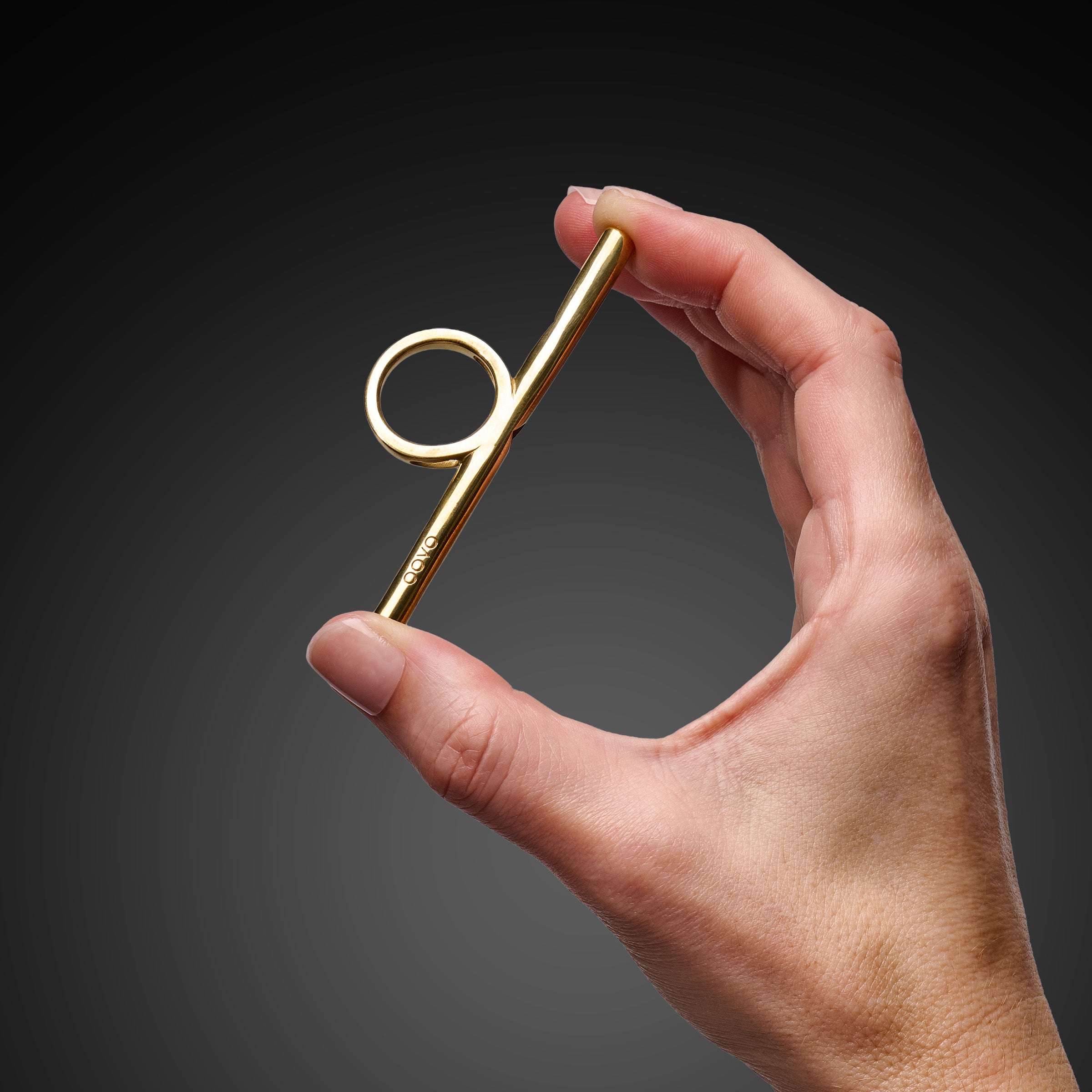 OOVO Sing Ring held in hand for scale