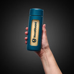 VocalGuard Glass Bottle — bottle held in hand against a dark studio background.