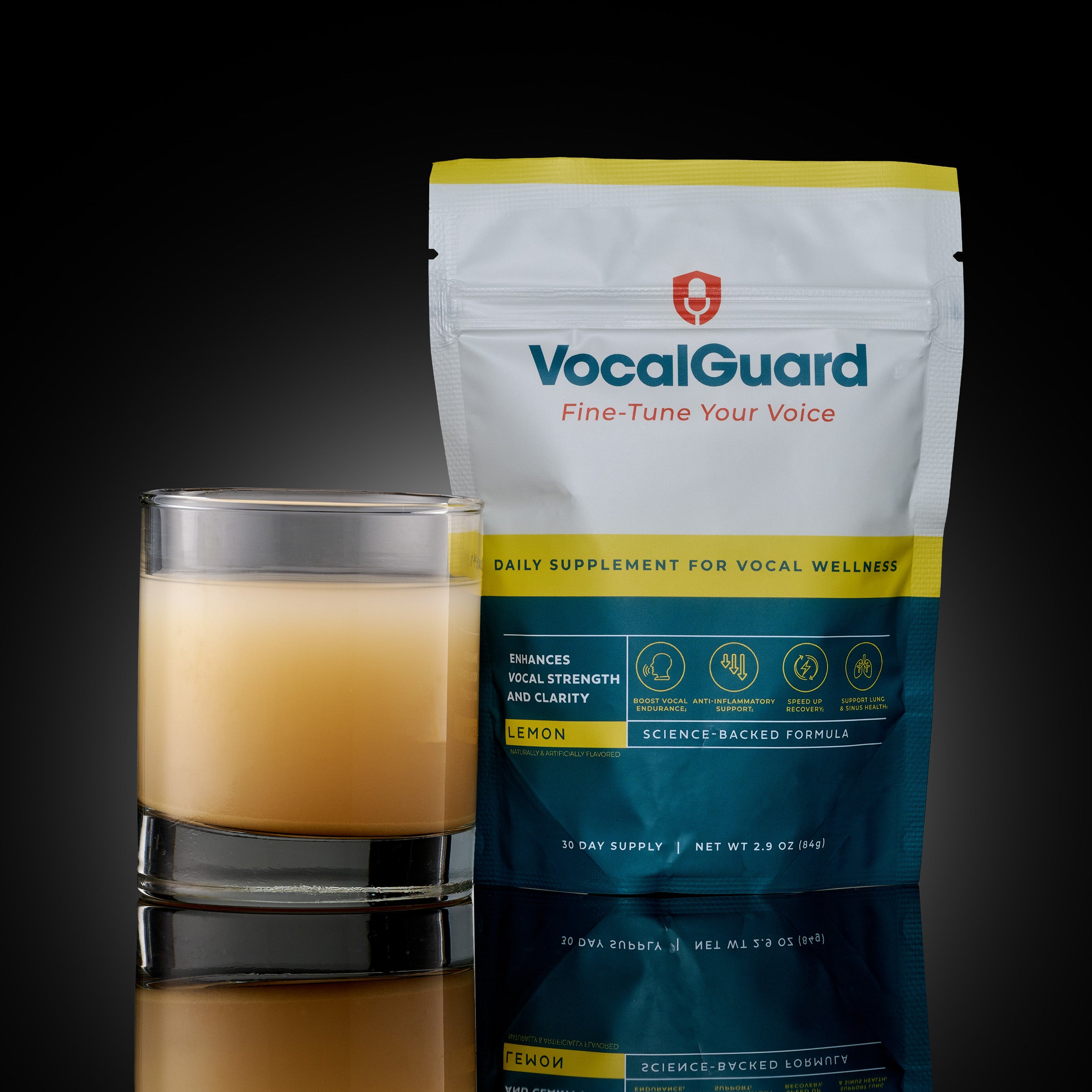 VocalGuard Lemon powder pouch (30-day supply) with mixed glass, studio shot