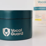 VocalGuard Vault — closed container on a white table with the VocalGuard pouch behind.