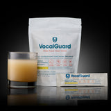 VocalGuard — single-serving stick pack on dark reflective glass.