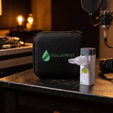 VocalMist carrying case and portable nebulizer on a studio side table.