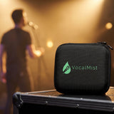 VocalMist carrying case on a road case while a singer rehearses at a microphone behind.