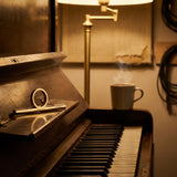 OOVO Sing Ring on a piano music ledge in a warm voice studio.