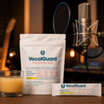 VocalGuard daily vocal supplement pouch beside a studio condenser microphone.